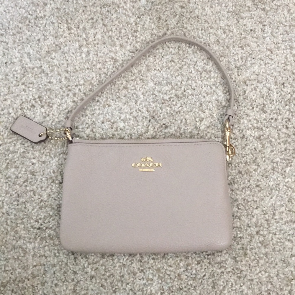 Beige coach wristlet